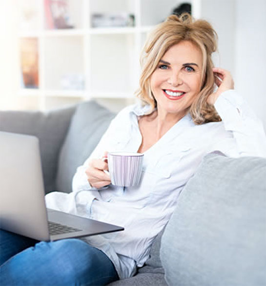 lady attending virtual session on couch